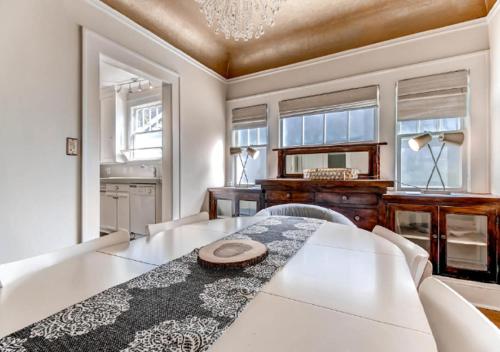 a dining room with a table and a piano at 30 Day+ Craftsman; Stroll 2 Food & Downtown! in Portland