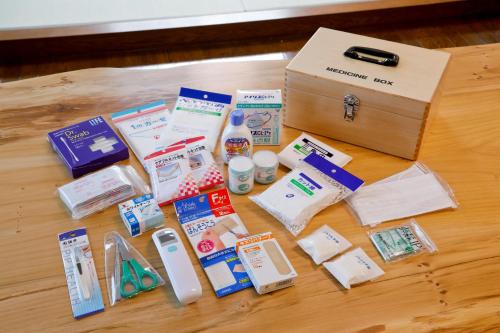 a table with a box of medicines and other items at 釜之宿 天王寺 in Osaka
