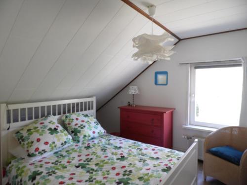 Postel nebo postele na pokoji v ubytování bb-oostkapelle vakantiewoning Iris
