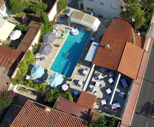 an overhead view of a swimming pool in a house at Le Galion Hotel et Restaurant Canet Plage - Logis in Canet-en-Roussillon