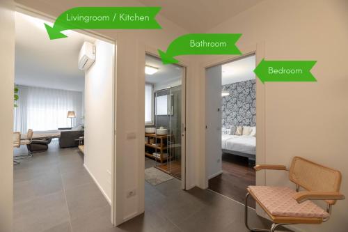 a room with green arrows pointing to a bedroom at Il Garovaglio in Como