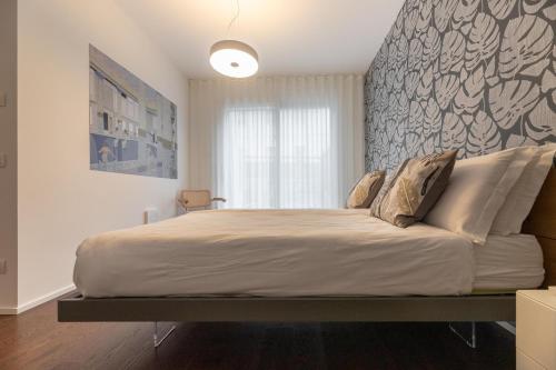 a bedroom with a large bed in a room at Il Garovaglio in Como