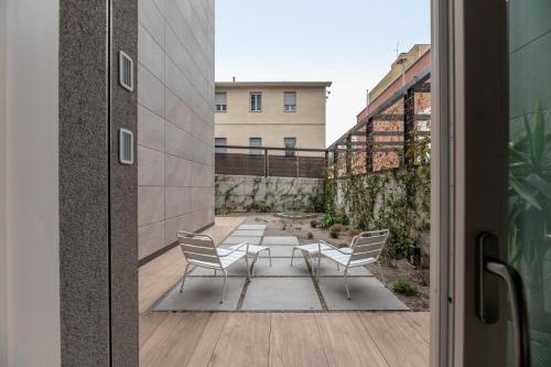 a view of a patio with two chairs and a table at Il Garovaglio in Como