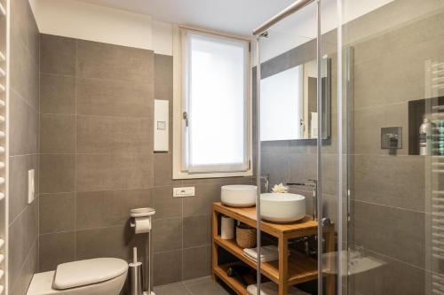 a bathroom with a toilet and a sink and a shower at Il Garovaglio in Como
