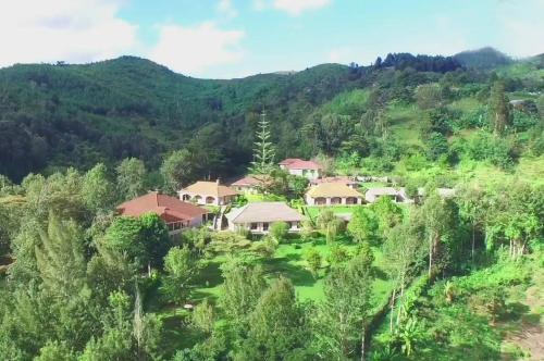 an aerial view of a house in the mountains at LUSHOTO EXECUTIVE LODGE in Lushoto