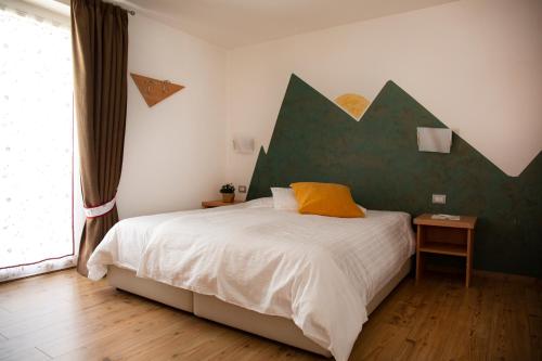 Ein Bett oder Betten in einem Zimmer der Unterkunft Baita Scaia