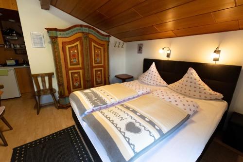 a bedroom with a large bed in a room at Ferienwohnungen Angermaier in Flattach