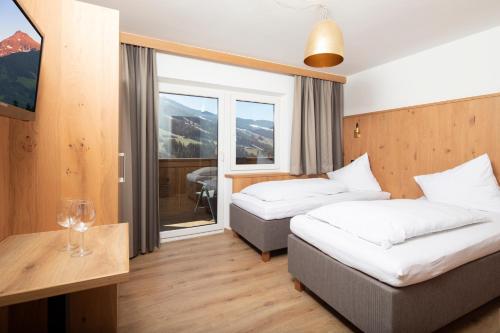 Postel nebo postele na pokoji v ubytování Hotel Andreas