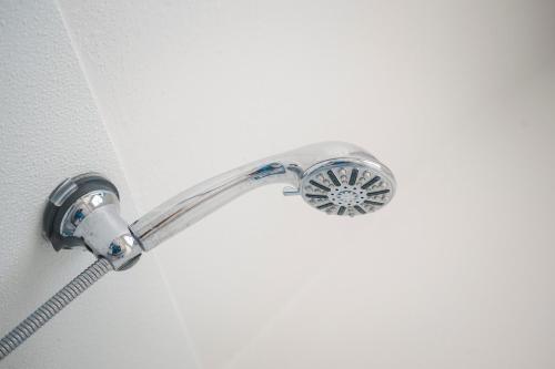 a shower head with a hose at Amargosa Opera House & Hotel in Death Valley Junction
