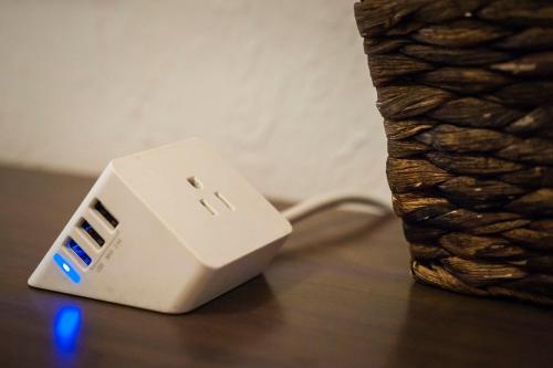 a white adapter sitting on top of a table at Amargosa Opera House & Hotel in Death Valley Junction