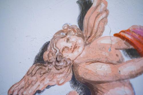 a painting of a stuffed animal on a wall at Amargosa Opera House & Hotel in Death Valley Junction