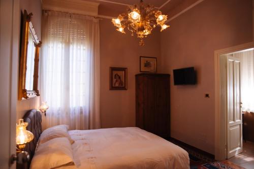 Katil atau katil-katil dalam bilik di Ai tre cedri B&B