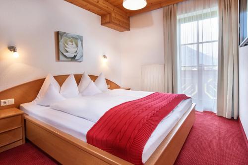 En eller flere senge i et værelse på Aparthotel Dachsteinblick
