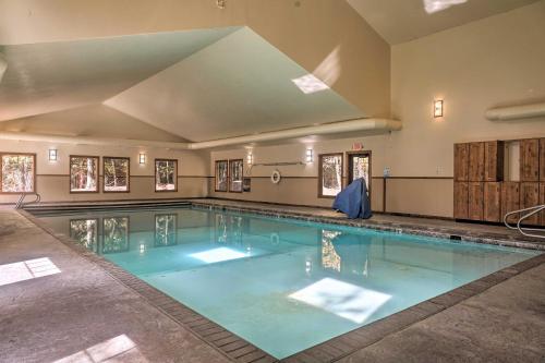 a large swimming pool with blue water at Airy Resort Condo Less Than 3 Miles to Whitefish Mountain! in Whitefish