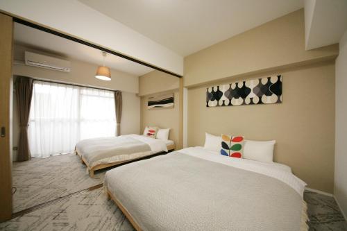 Katil atau katil-katil dalam bilik di goom Hotel Fukuoka-Tenjin