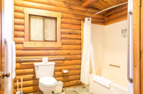 a bathroom with a toilet and a sink at North Forty Resort in Columbia Falls