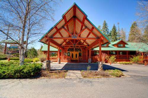 a large wooden building with a large front door at North Forty Resort in Columbia Falls