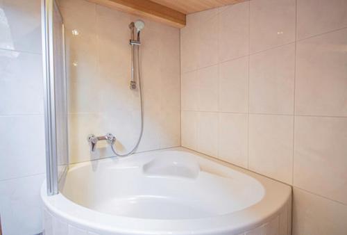a bathroom with a shower and a sink at Ferienwohnung Kienast in Pfons