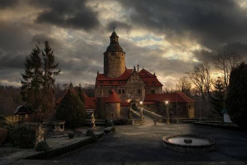a large building with a tower on top of it at Zamek Czocha in Leśna