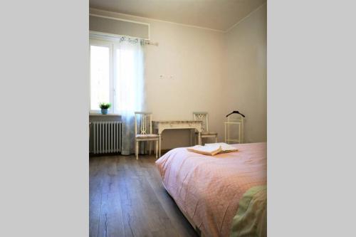 A bed or beds in a room at Delizioso appartamento cosy ristrutturato