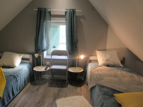 Un pat sau paturi într-o cameră la La Ferme de la Chapelle-Saint-Jean