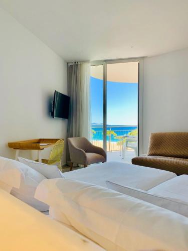 Hotel Aromarにあるベッド