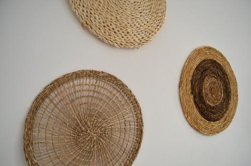 two baskets and a hat on a white background at Hôtel & Espace Bien-être La Maison du Lierre in Biarritz