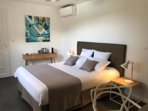 Postel nebo postele na pokoji v ubytování Villa Limone, maison d'hôtes