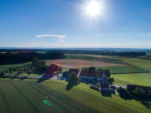 an aerial view of a house in a field at Hotel-Landgasthof KREUZ in Bad Waldsee