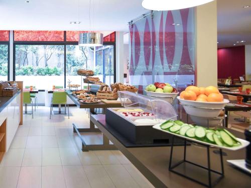 
a buffet table with many different types of food at Novotel Athens in Athens
