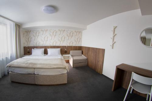 Postel nebo postele na pokoji v ubytování Hotel Prichovice