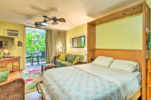 a bedroom with a bed and a living room at First Responders Book With Us - Kona Islander Inn! in Kailua-Kona