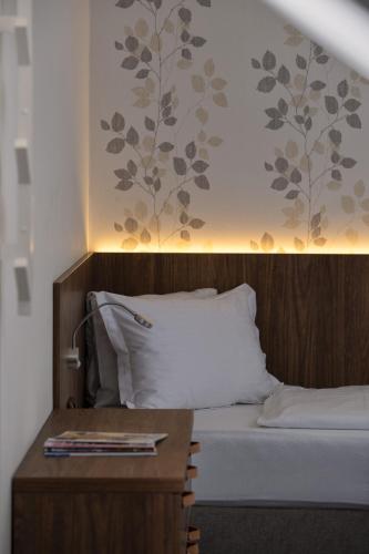 Postel nebo postele na pokoji v ubytování Hotel Prichovice