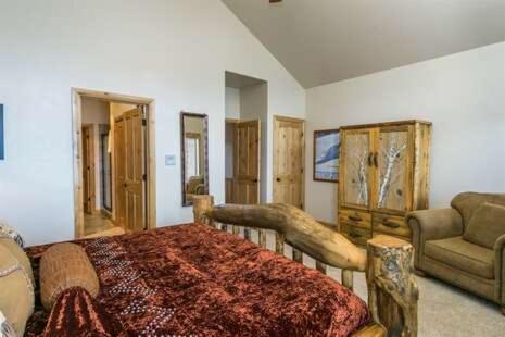 a bedroom with a large bed and a couch at 2 Bedroom Snowbasin Vacation Rental - Huntsville, Utah Lodging Options LS63 in Huntsville