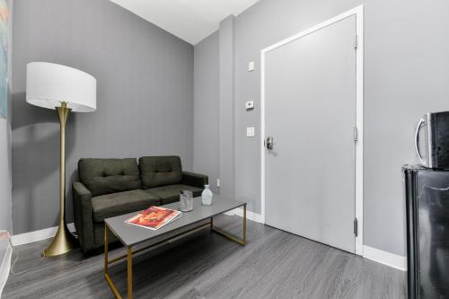 a living room with a couch and a table at Temple Place Suites in Boston