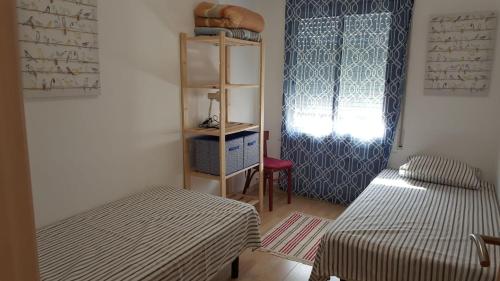 Cama ou camas em um quarto em Precioso apartamento a menos de 100m de la playa