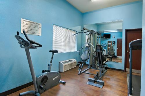 a gym with two exercise bikes in a room at Oxford Suites Hermiston in Hermiston