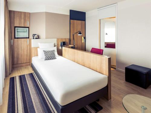 En eller flere senge i et værelse på Mercure Hotel Nijmegen Centre
