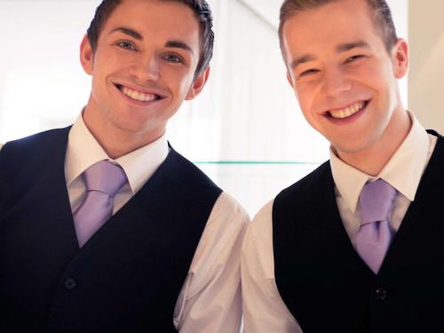 two men in vest and tie posing for a picture at Mercure Hotel Nijmegen Centre in Nijmegen