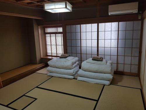 ゲストハウスじんく にあるベッド