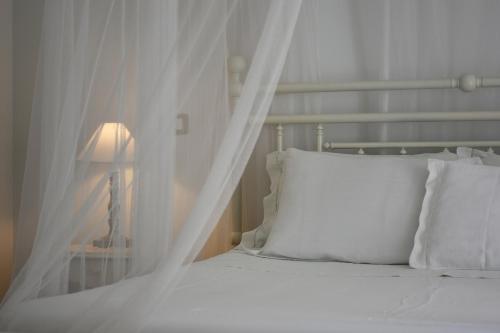 Postel nebo postele na pokoji v ubytování Agriturismo di Charme erbadoro