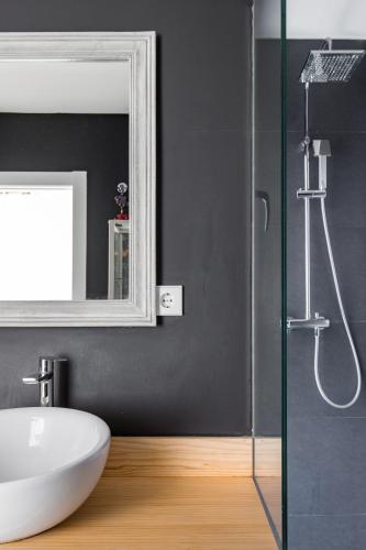 a bathroom with a white sink and a mirror at Luxury Villa Beach & Golf in San Juan de Alicante