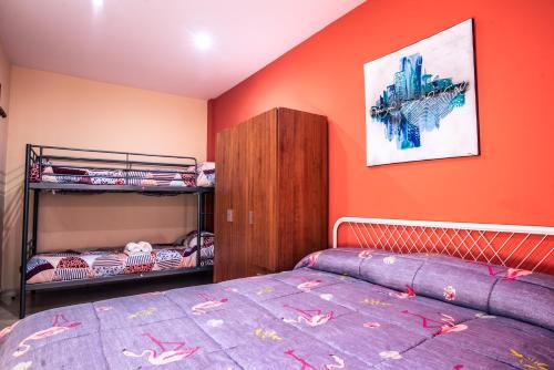 a bedroom with a bed and a bunk bed at Apartaments Yaco in Lloret de Mar