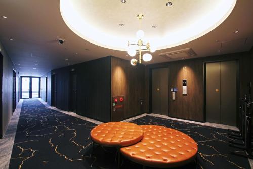 a room with a circular table in a building at Kobe Plaza Hotel West in Kobe