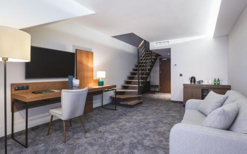 TV a/nebo společenská místnost v ubytování Green Mountain 5* Hotel