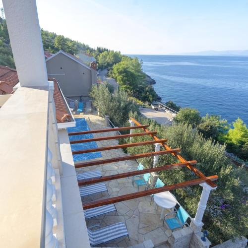 a balcony with a view of the ocean at House Green Side Sunset in Prigradica