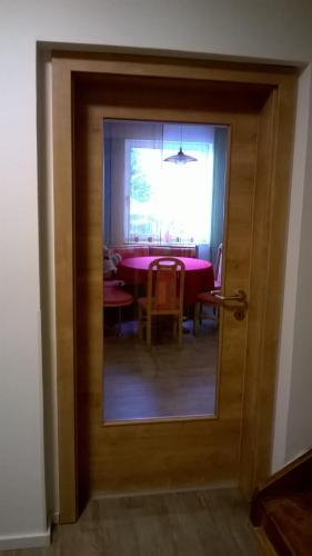 a view through a door into a dining room at Landhotel SONNENHOF MotorradKrauk in Ulrichsberg