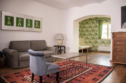 a living room with a couch and a table at Polyák villa in Révfülöp