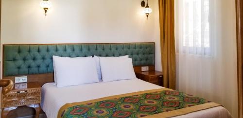 Cama o camas de una habitación en Gumus Konak