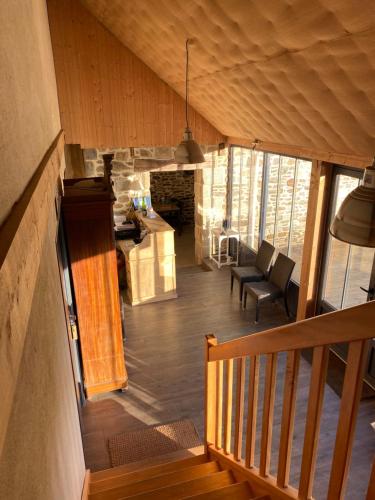 a room with a staircase and a living room at Maison d'hôtes & Gîtes Domaine de la Garaye in Dinan